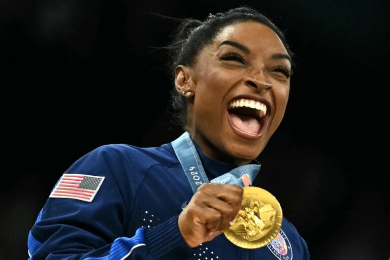 Simone Biles holds her gold medal during the Paris 2024 Olympic Games at the Bercy Arena in Paris, on Tuesday.Lionel Bonaventure / AFP - Getty Images