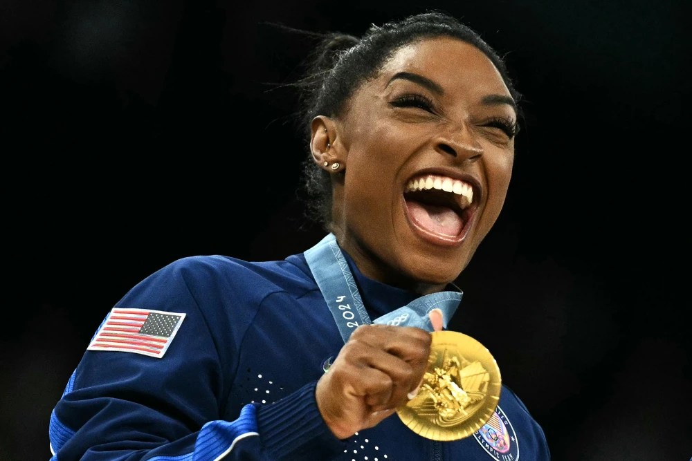 Simone Biles holds her gold medal during the Paris 2024 Olympic Games at the Bercy Arena in Paris, on Tuesday.Lionel Bonaventure / AFP - Getty Images