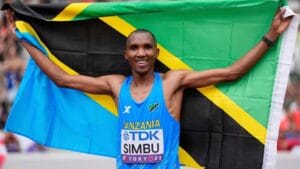 Tanzania's Alphonce Felix Simbu poses after winning the gold medal in the men's marathon.
