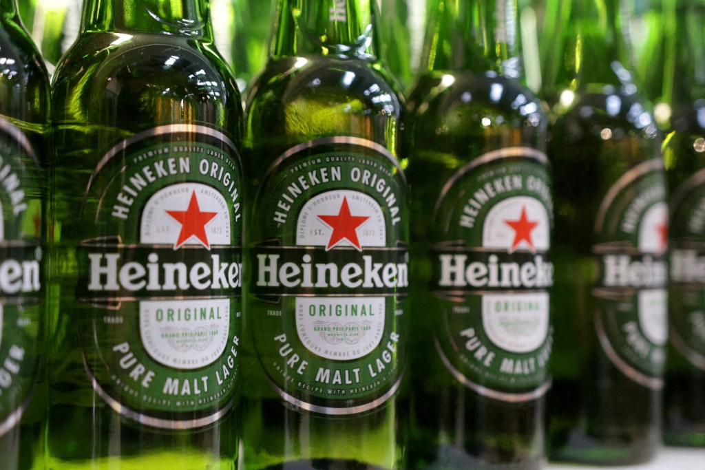 Bottles of Heineken beer are displayed in a supermarket. | REUTERS/Dado Ruvic.