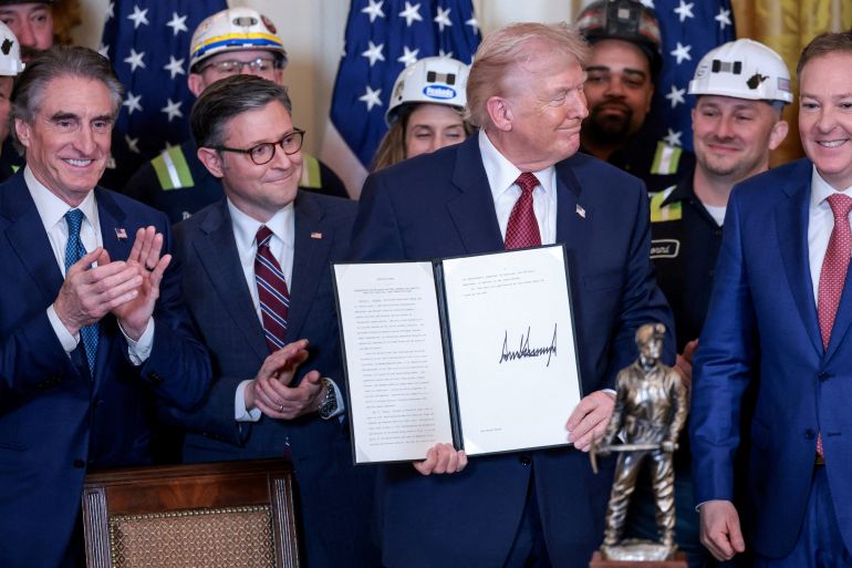 US President Donald Trump holds an executive order on coal-fired power plants during a ceremony at the White House in Washington, DC, on February 11, 2026 | Jonathan Ernst/Reuters
