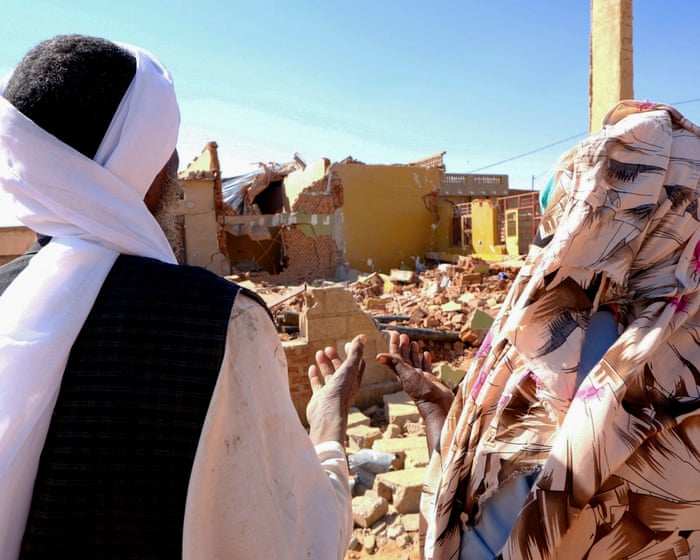 People pray in front of a house hit by a drone in El Obeid, North Kordofan state in January. The UN said the RSF also hit an aid convoy in the state on Friday. | El Tayeb Siddig/Reuter