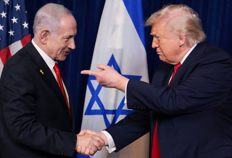 U.S. President Donald Trump and Israeli Prime Minister Benjamin Netanyahu shake hands during a news conference at Trump’s Mar-a-Lago club in Palm Beach, Florida, on Dec. 29. Netanyahu's arrival at the White House on Wednesday was lower-key than usual. | REUTERS