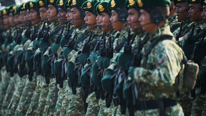 Indonesian soldiers march during a ceremony commemorating the 80th anniversary of the Indonesian Armed Forces in Jakarta, Indonesia. | AP Photo/Tatan Syuflana
