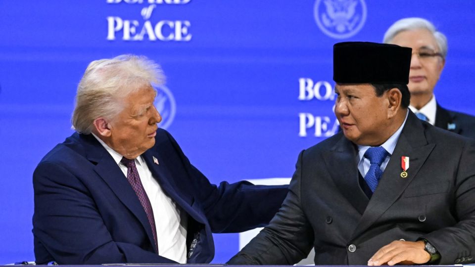 US President Donald Trump (L) shakes hands with Indonesia's President Prabowo Subianto at the "Board of Peace" meeting during the World Economic Forum annual meeting in Davos on January 22, 2026. | AFP