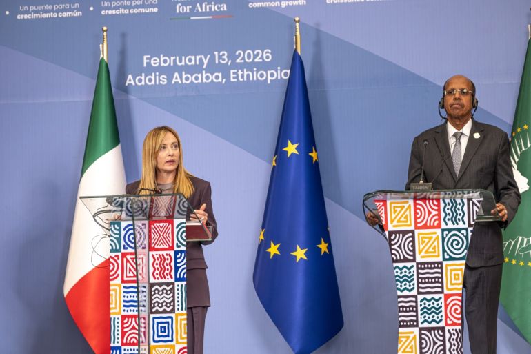 Chairperson of the African Union Commission Mahmoud Ali Youssouf (right) listens as Italian Prime Minister Giorgia Meloni (left) speaks during the closing news conference of the Second Italy-Africa Summit at the Addis International Convention Center (AICC) in Addis Ababa, February 13, 2026 | Marco Simoncelli/AFP