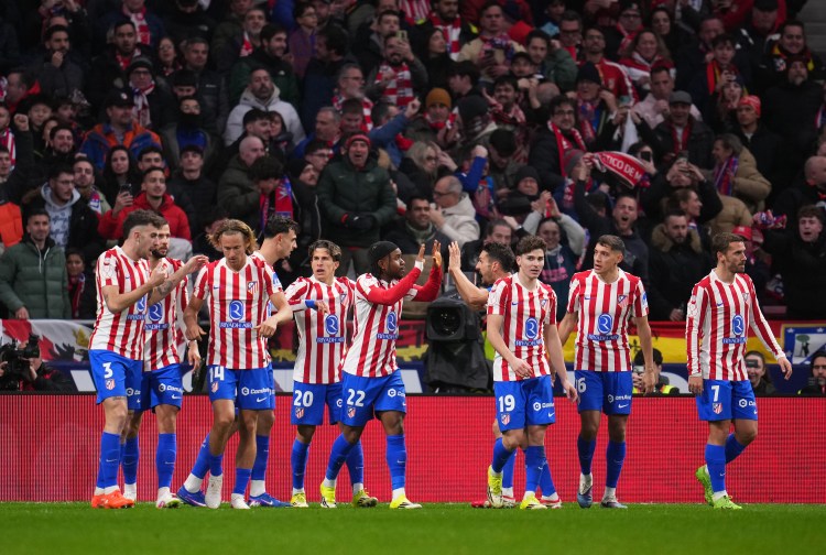 Ademola Lookman of Atletico de Madrid celebrates his team’s first goal with team mates, an own goal by Eric Garcia of FC Barcelona (not pictured), during the Copa Del Rey Semi-Final First Leg match between Atletico de Madrid and FC Barcelona at Riyadh Air Metropolitano on February 12, 2026 in Madrid, Spain. | Aitor Alcalde/Getty Images Getty Images