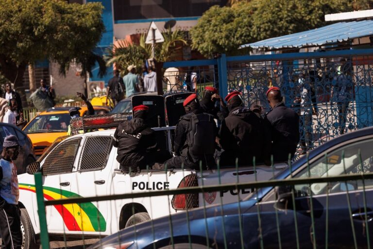 Riot police sit on their pickup truck as they drive into the Cheikh Anta Diop University campus, which was closed to students today until further notice after clashes between students and security forces left one student dead during protests over stipends and other financial support amid the government’s fiscal challenges, in Dakar, Senegal, February 10, 2026. | REUTERS/Zohra Bensemra
