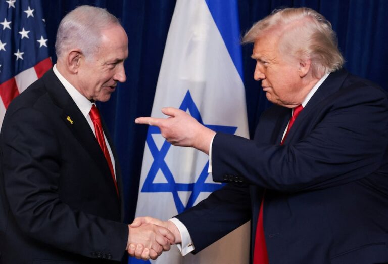 U.S. President Donald Trump points his finger towards Israeli Prime Minister Benjamin Netanyahu as they shake hands during a press conference after meeting at Trump’s Mar-a-Lago club in Palm Beach, Florida, U.S., December 29, 2025. | REUTERS/Jonathan Ernst