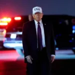 President Donald Trump looks on after disembarking Air Force One at Palm Beach International Airport in West Palm Beach, Florida. | Elizabeth Frantz/REUTERS